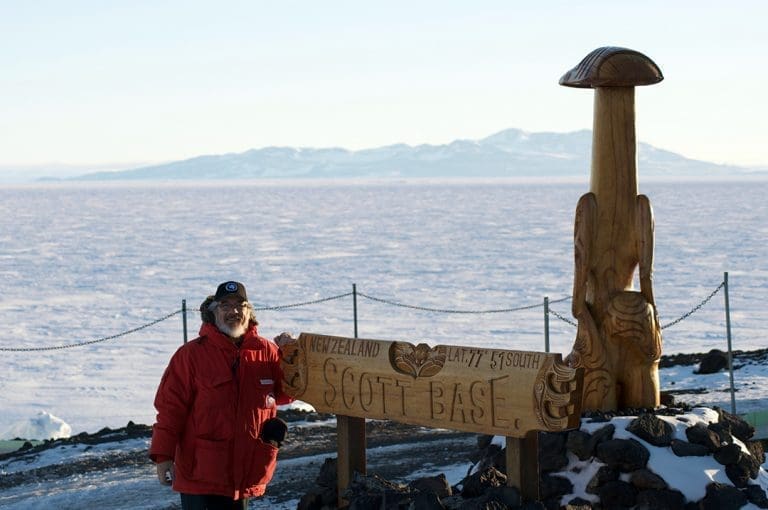 Glenn standing in front of Scott Base sign