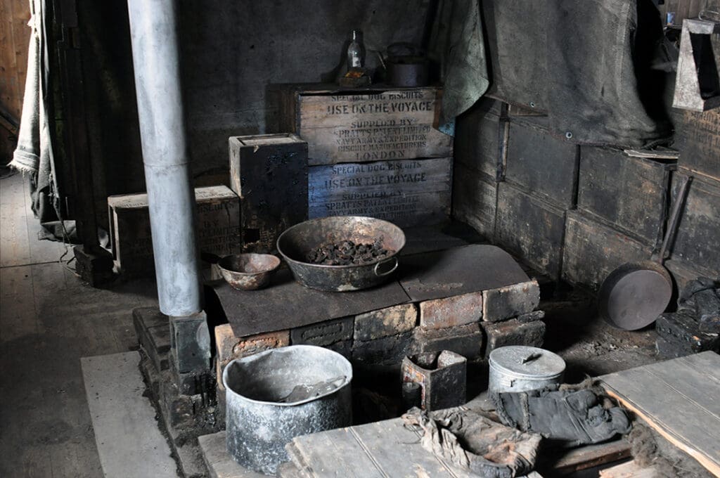 Old kitchen with pots and brick oven.