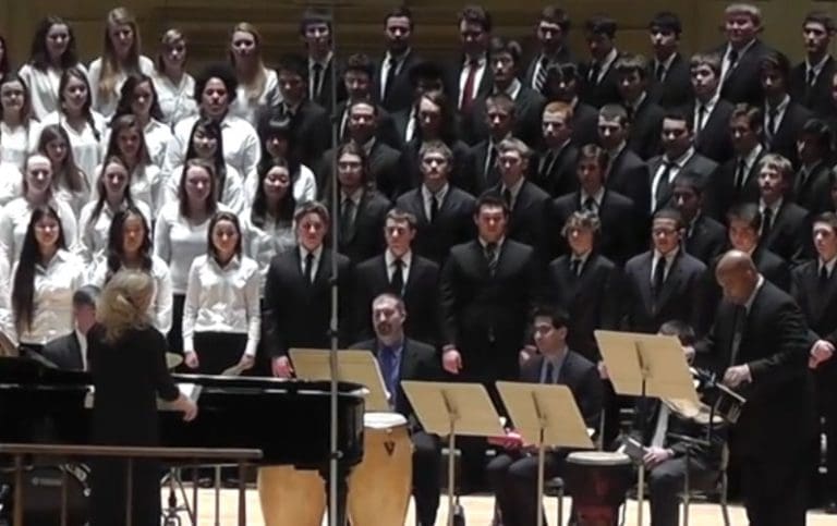 Choir performing Kyrie Concert SATB (one steel drum, piano, percussion)