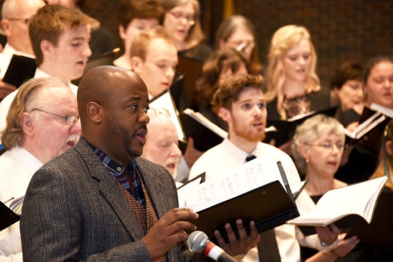 Jorell Williams singing with a choir